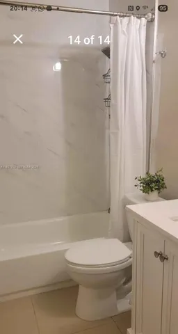 a bathroom with a toilet and a bathtub