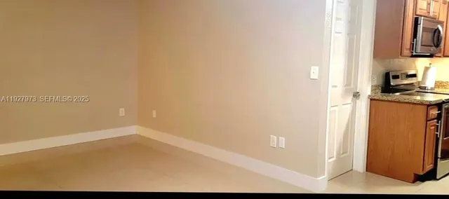 a view of a kitchen with wooden floor