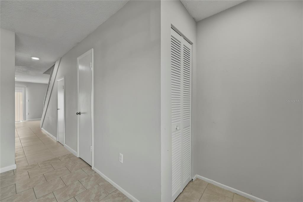 4799 Sisson Road Titusville, FL 32780 - Photo 6 of 23 a view of a hallway with wooden floor