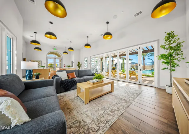 a living room with couches and a flat screen tv