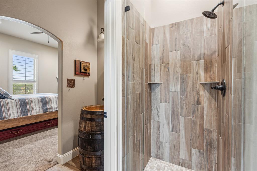 4180 North Smith Road Fate, TX 75087 - Photo 21 of 27 Bathroom featuring tiled shower