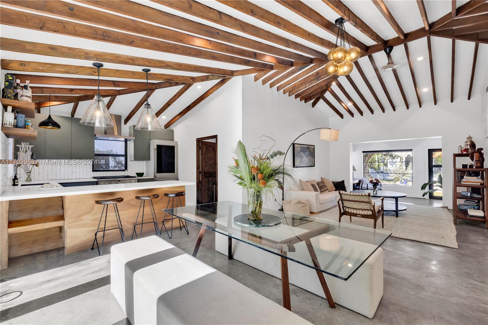 56 Northeast 46th Street Miami, FL 33137 - Photo 1 of 28 a living room with furniture and a chandelier
