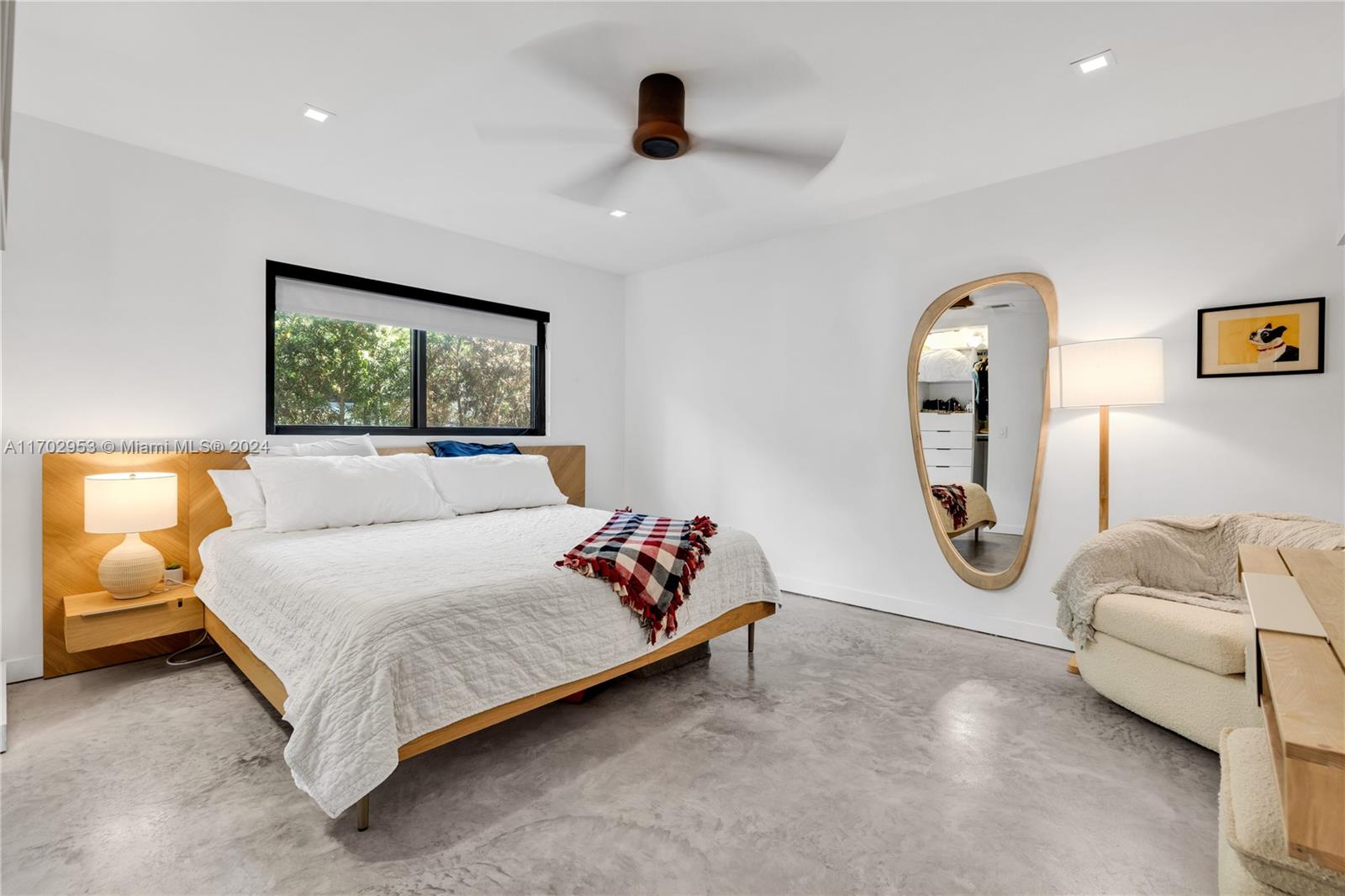 56 Northeast 46th Street Miami, FL 33137 - Photo 14 of 28 a bedroom with a bed and glass window