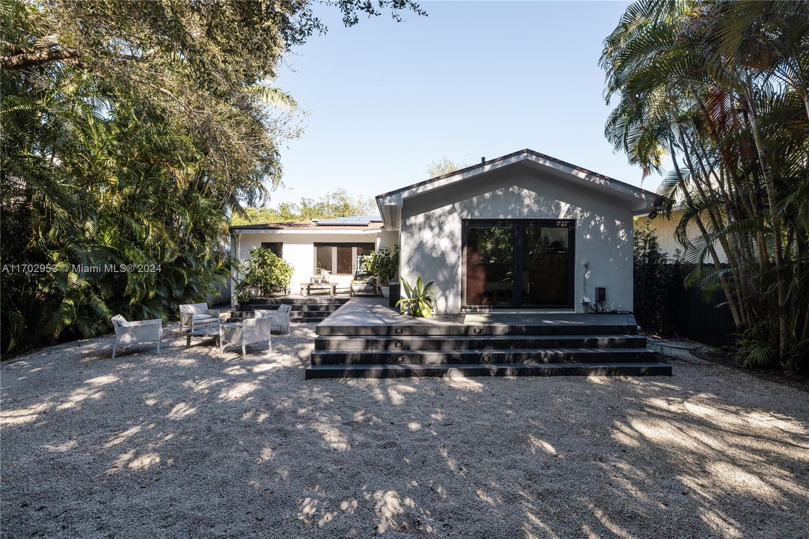 56 Northeast 46th Street Miami, FL 33137 - Photo 21 of 28 a front view of a house with a garden
