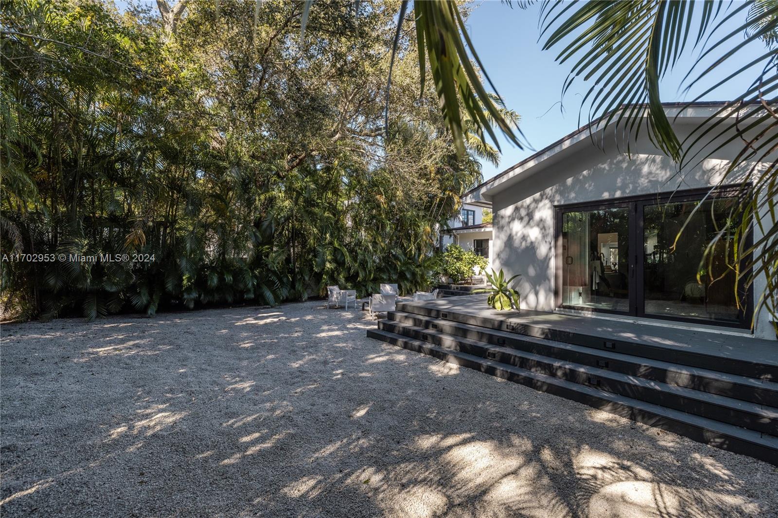 56 Northeast 46th Street Miami, FL 33137 - Photo 22 of 28 a view of a house with backyard and sitting area