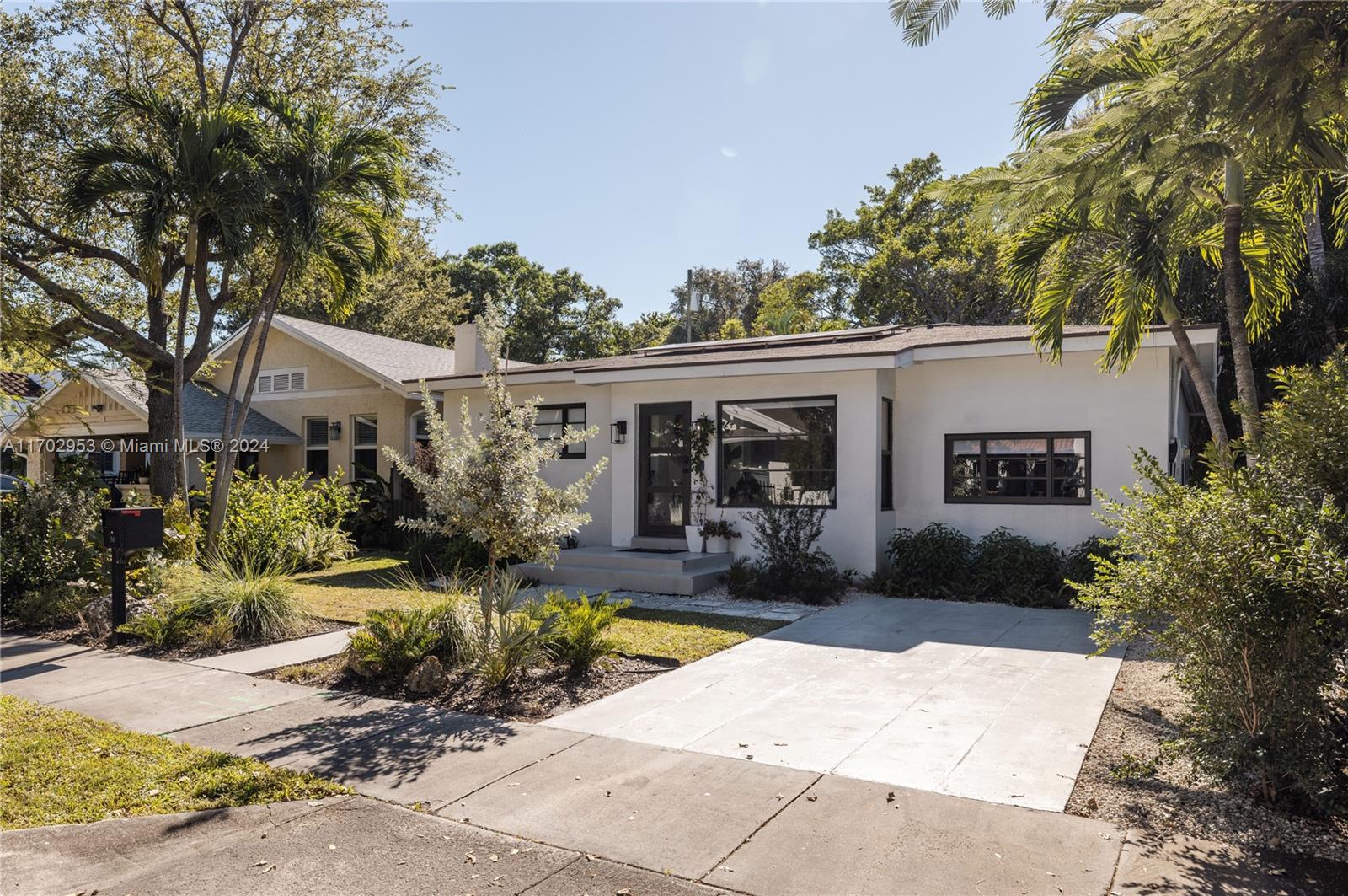 56 Northeast 46th Street Miami, FL 33137 - Photo 25 of 28 a view of a house with sitting area and garden