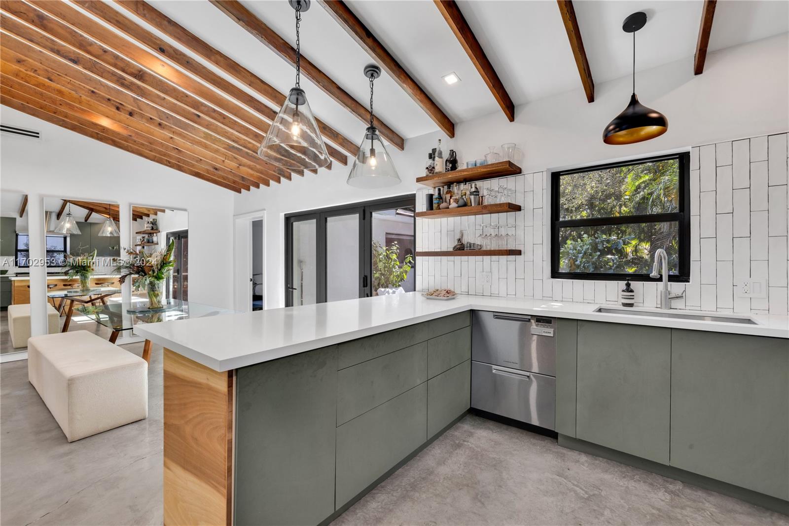 56 Northeast 46th Street Miami, FL 33137 - Photo 8 of 28 a large white kitchen with a large window