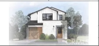 a front view of a house with a tree