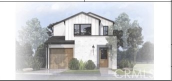 a front view of a house with a tree