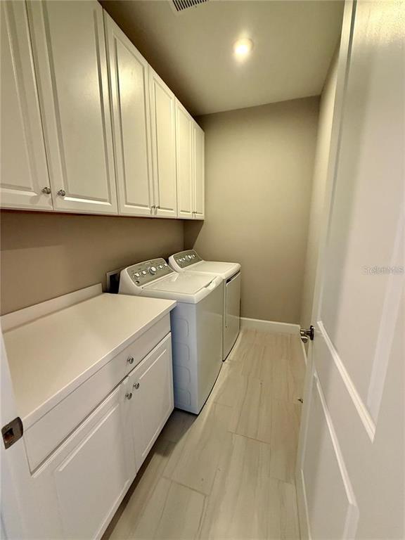 5967 Maidenstone Way Palmetto, FL 34221 - Photo 20 of 28 a utility room with dryer and washer