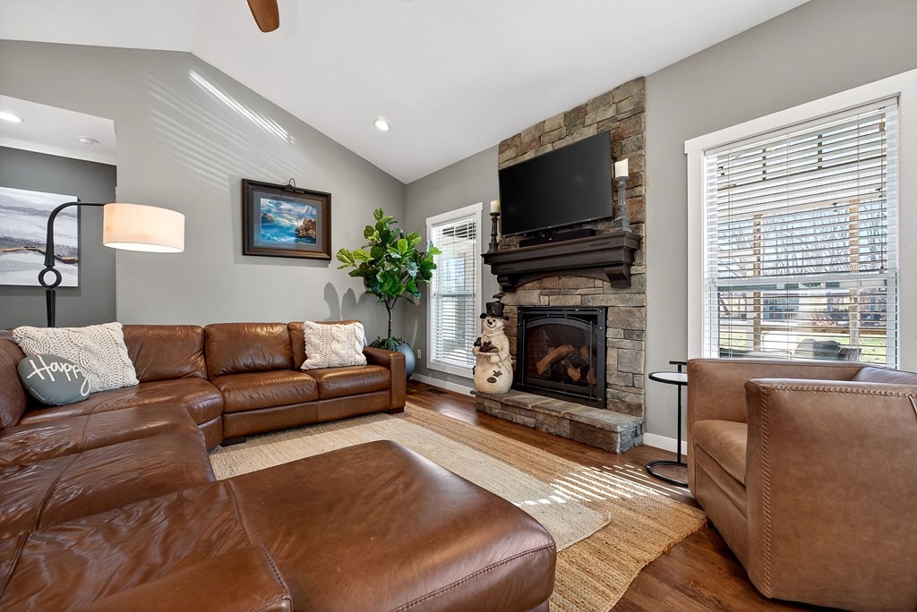 6081 Buck Mountain Road Cookeville, TN 38506 - Photo 15 of 71 a living room with furniture a flat screen tv and a fireplace