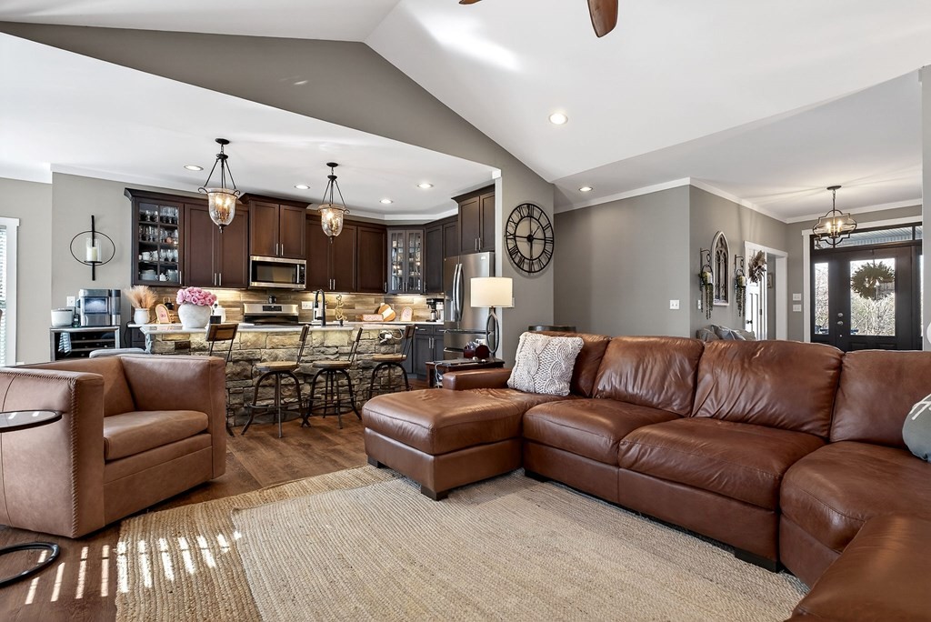 6081 Buck Mountain Road Cookeville, TN 38506 - Photo 2 of 71 a living room with furniture kitchen and a chandelier