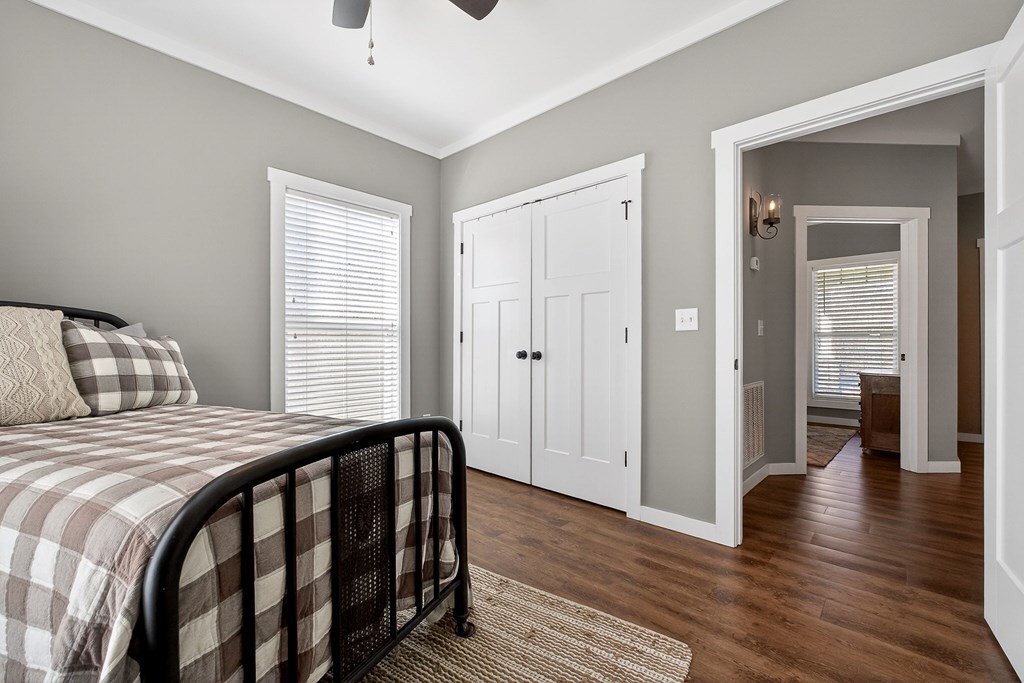 6081 Buck Mountain Road Cookeville, TN 38506 - Photo 21 of 71 a bedroom with a bed and wooden floor