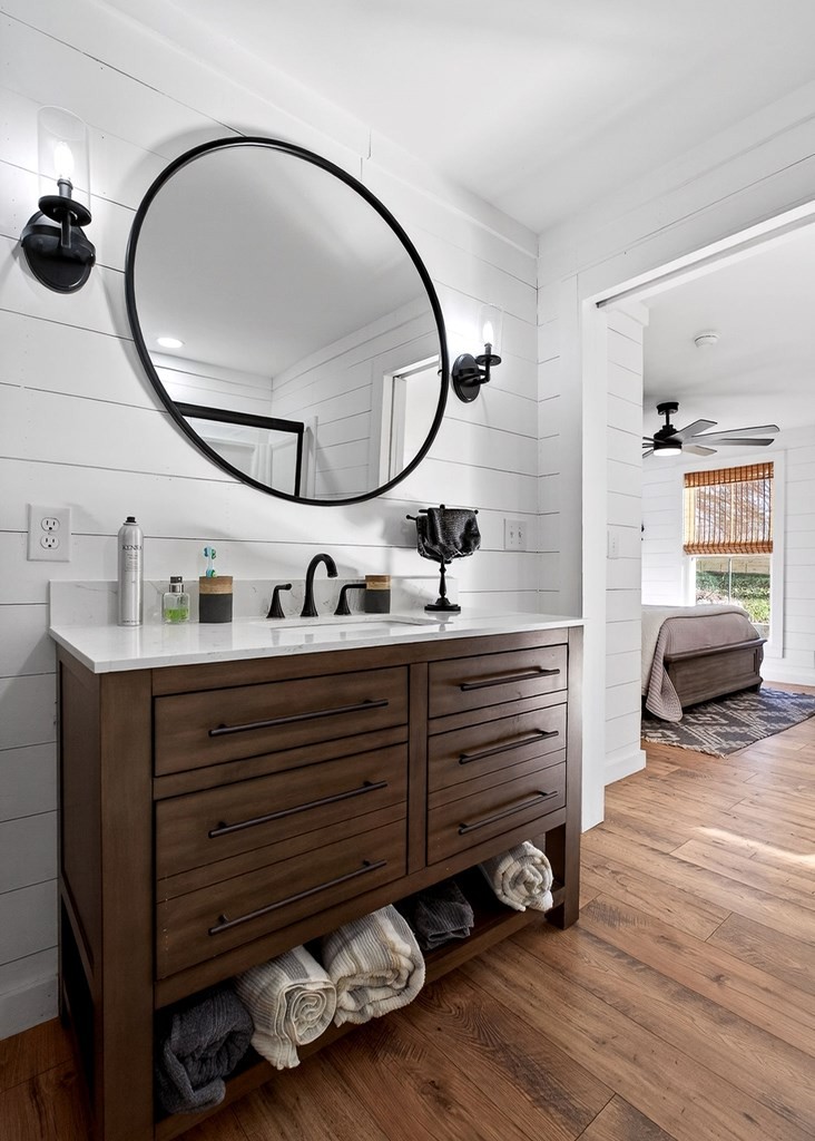 6081 Buck Mountain Road Cookeville, TN 38506 - Photo 22 of 71 a bathroom with a sink mirror and vanity