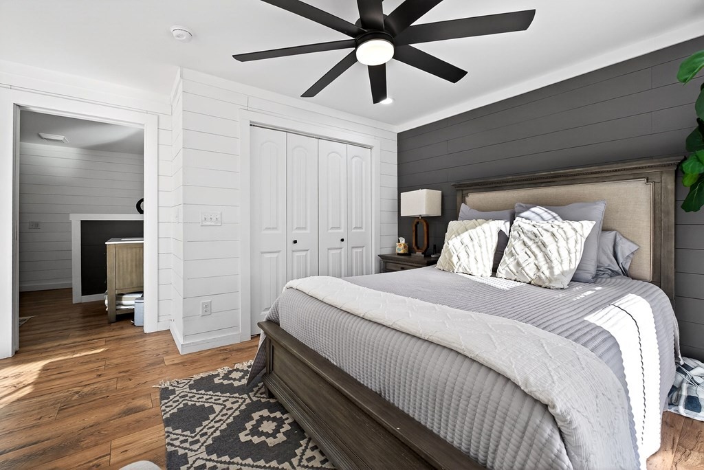 6081 Buck Mountain Road Cookeville, TN 38506 - Photo 23 of 71 a bedroom with a bed and a chandelier