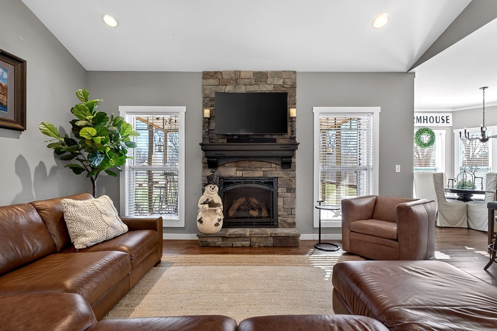 6081 Buck Mountain Road Cookeville, TN 38506 - Photo 3 of 71 a living room with furniture a flat screen tv and a fireplace