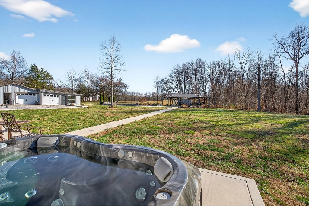 6081 Buck Mountain Road Cookeville, TN 38506 - Photo 31 of 71 a view of a swimming pool with a yard