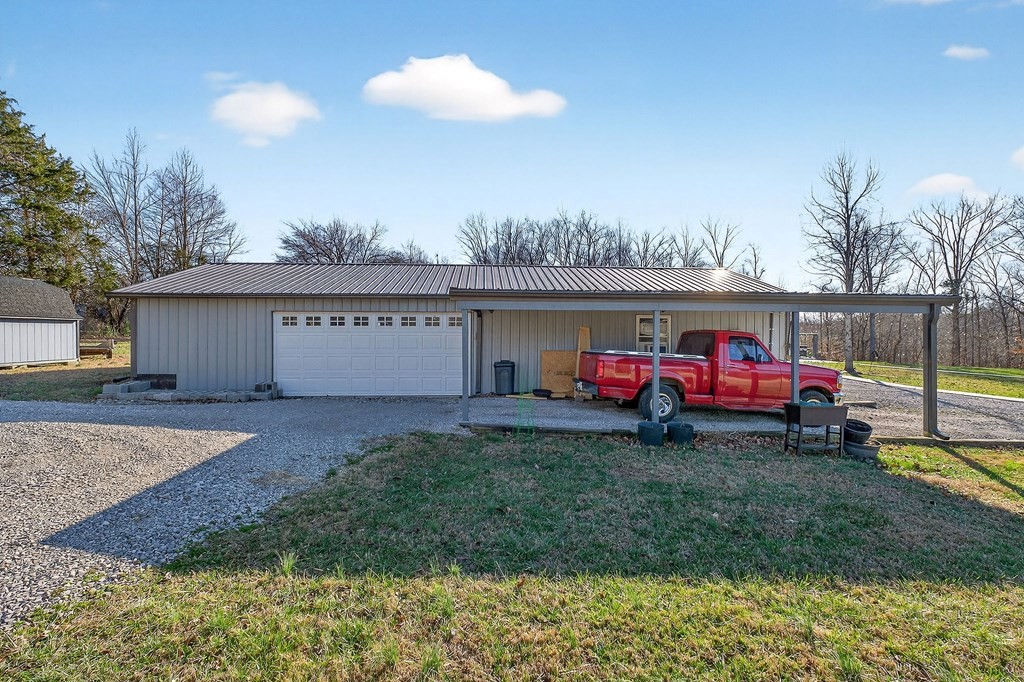 6081 Buck Mountain Road Cookeville, TN 38506 - Photo 45 of 71 a view of a house with backyard and sitting area