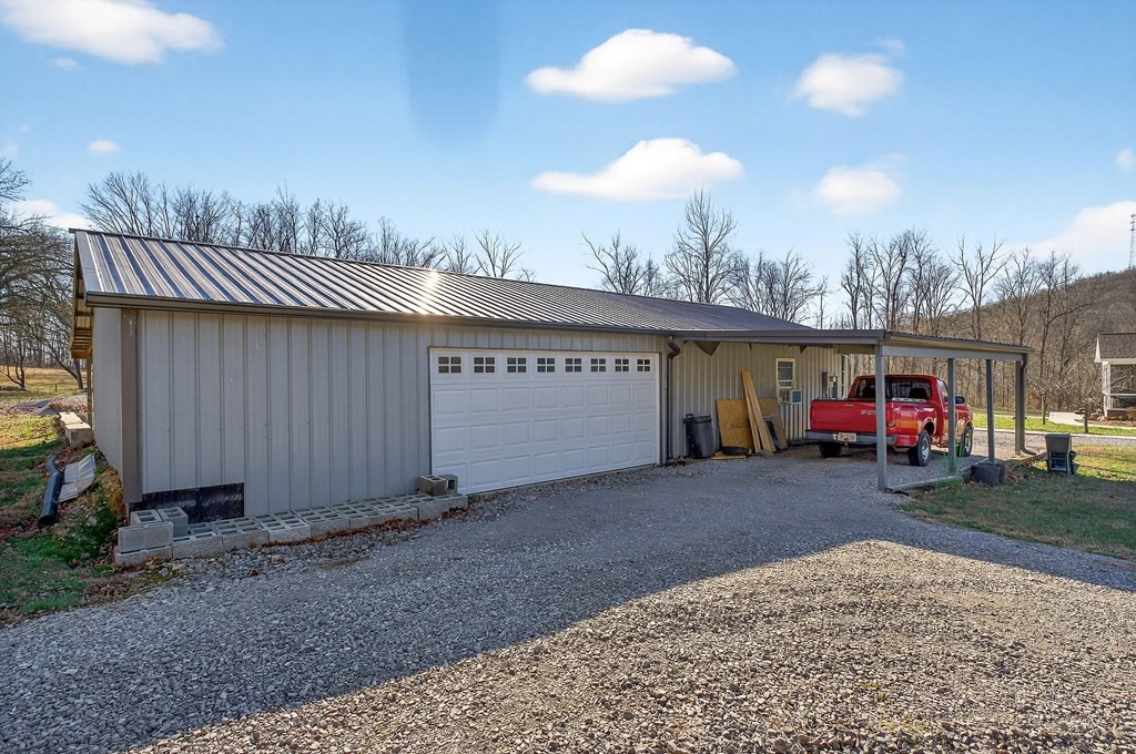 6081 Buck Mountain Road Cookeville, TN 38506 - Photo 46 of 71 a view of a house with a patio and a yard