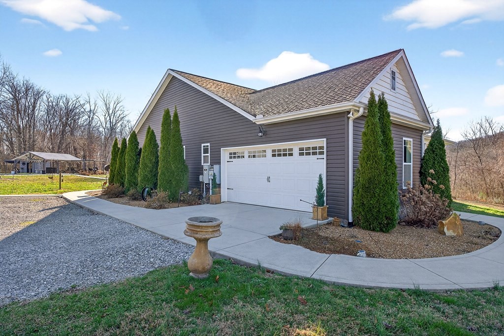 6081 Buck Mountain Road Cookeville, TN 38506 - Photo 8 of 71 a view of a house with backyard and a tree