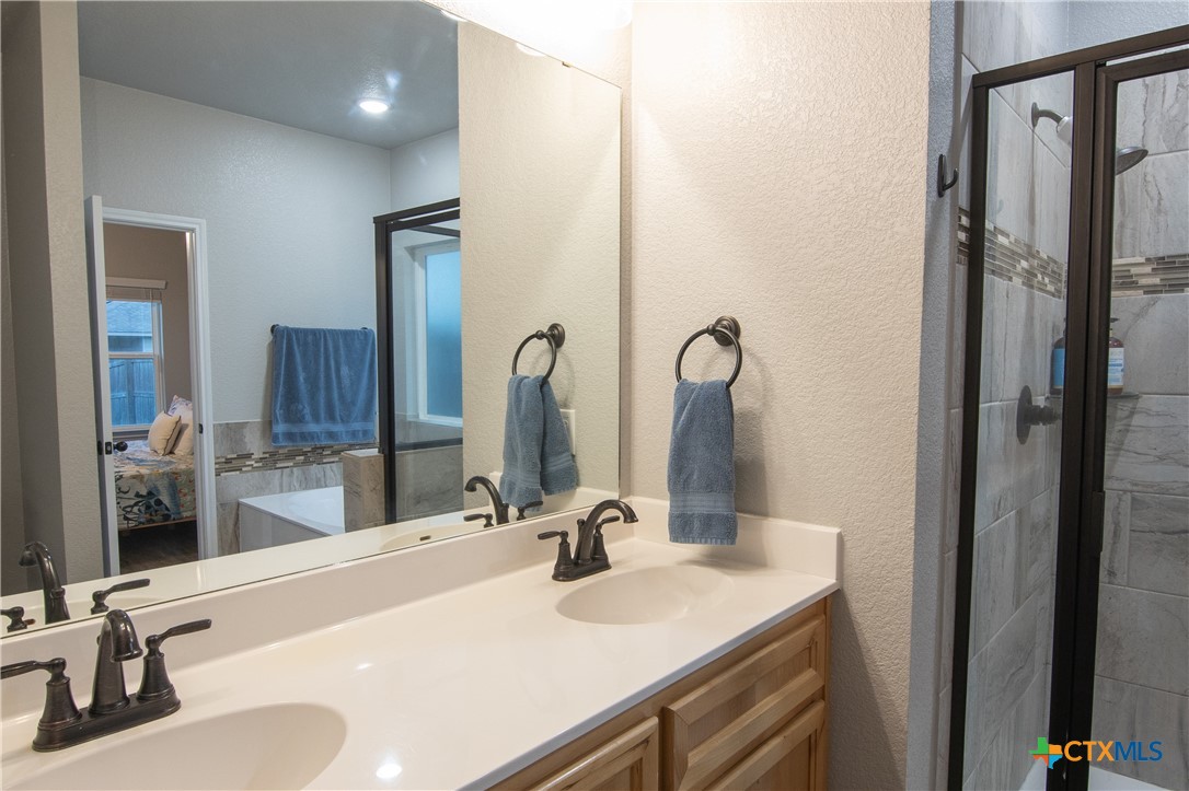 7909 McCulloch Road Temple, TX 76502 - Photo 36 of 46 a bathroom with a sink and a mirror