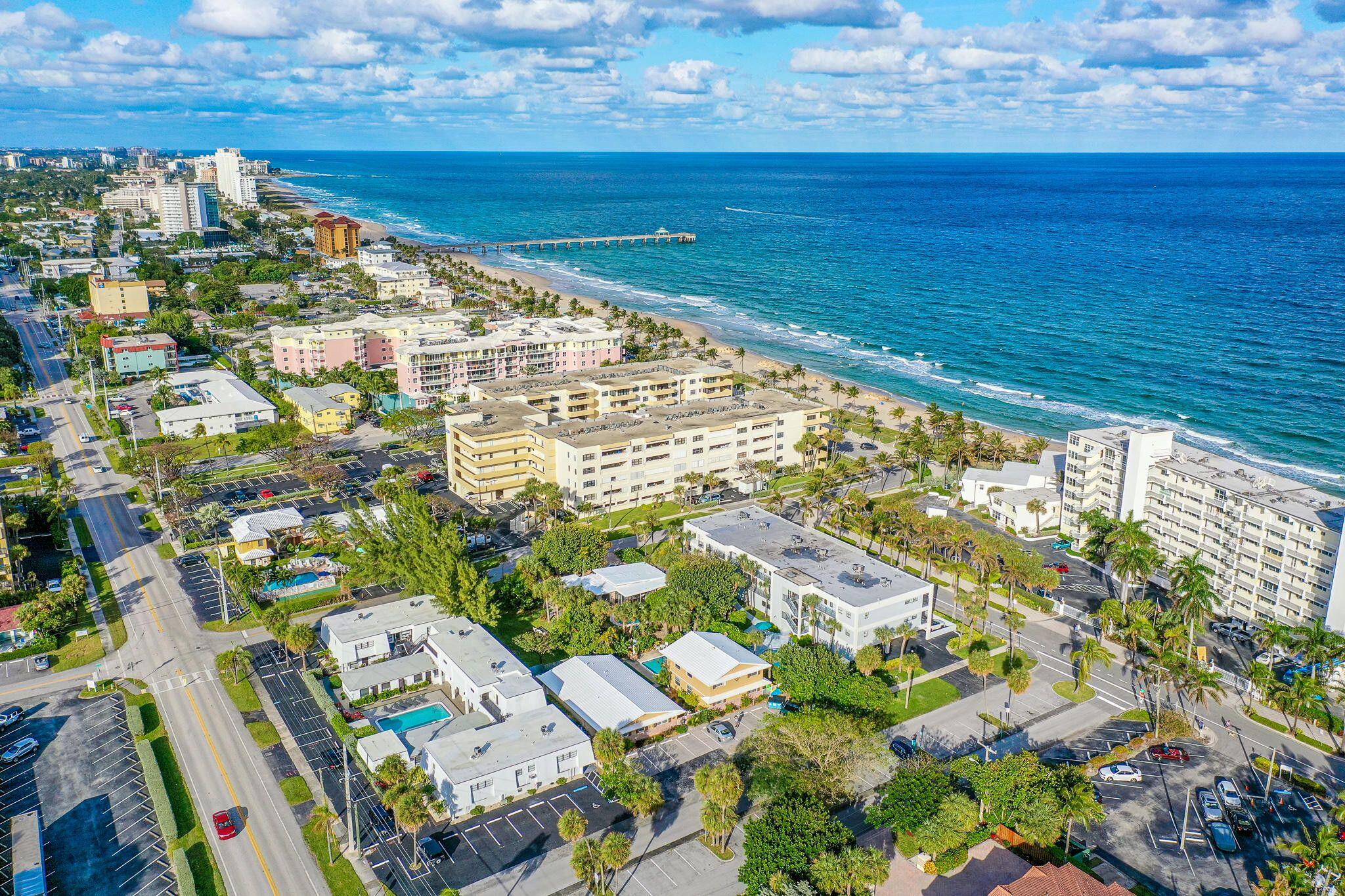 2031 Southeast 5th Street, Unit 8 Deerfield Beach, FL 33441 - Photo 1 of 13 a view of yard with an ocean view
