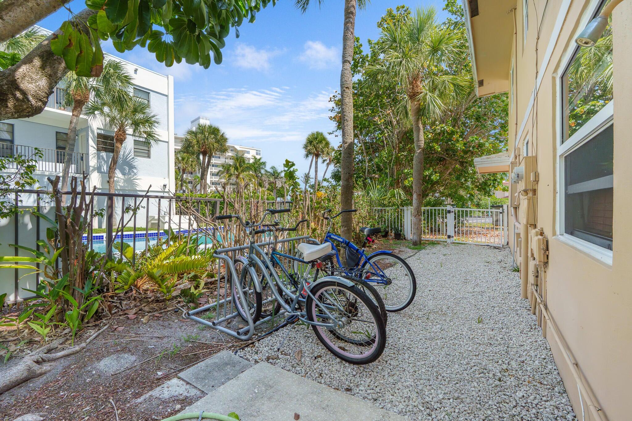 2031 Southeast 5th Street, Unit 8 Deerfield Beach, FL 33441 - Photo 12 of 13 a couple of bicycles parked next to a house