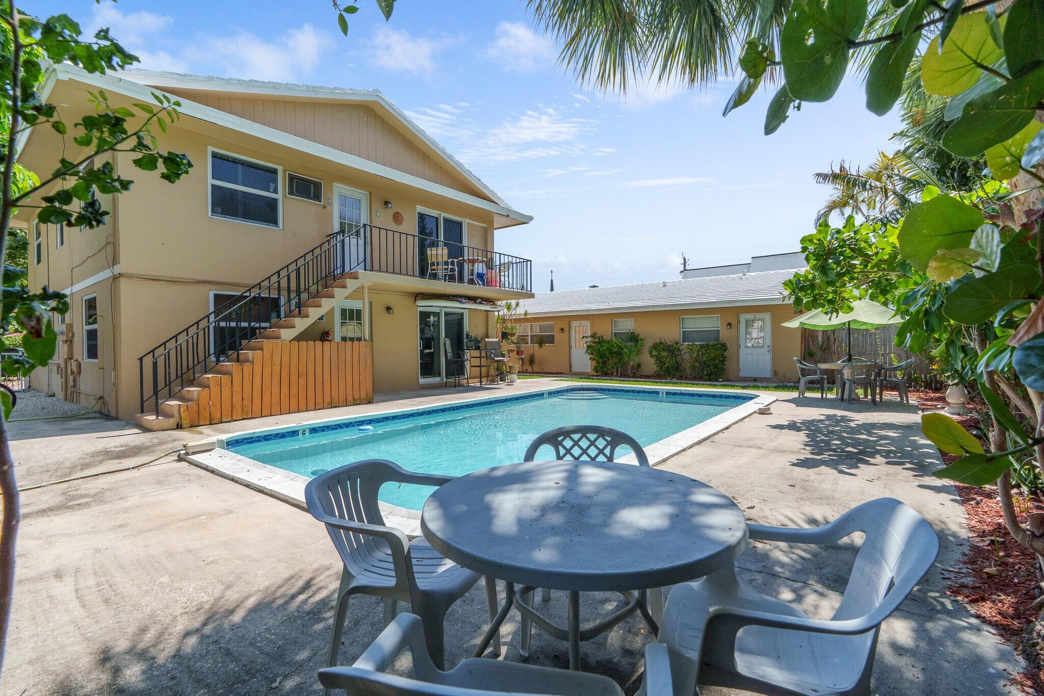 2031 Southeast 5th Street, Unit 8 Deerfield Beach, FL 33441 - Photo 4 of 13 a view of a house with backyard and sitting area
