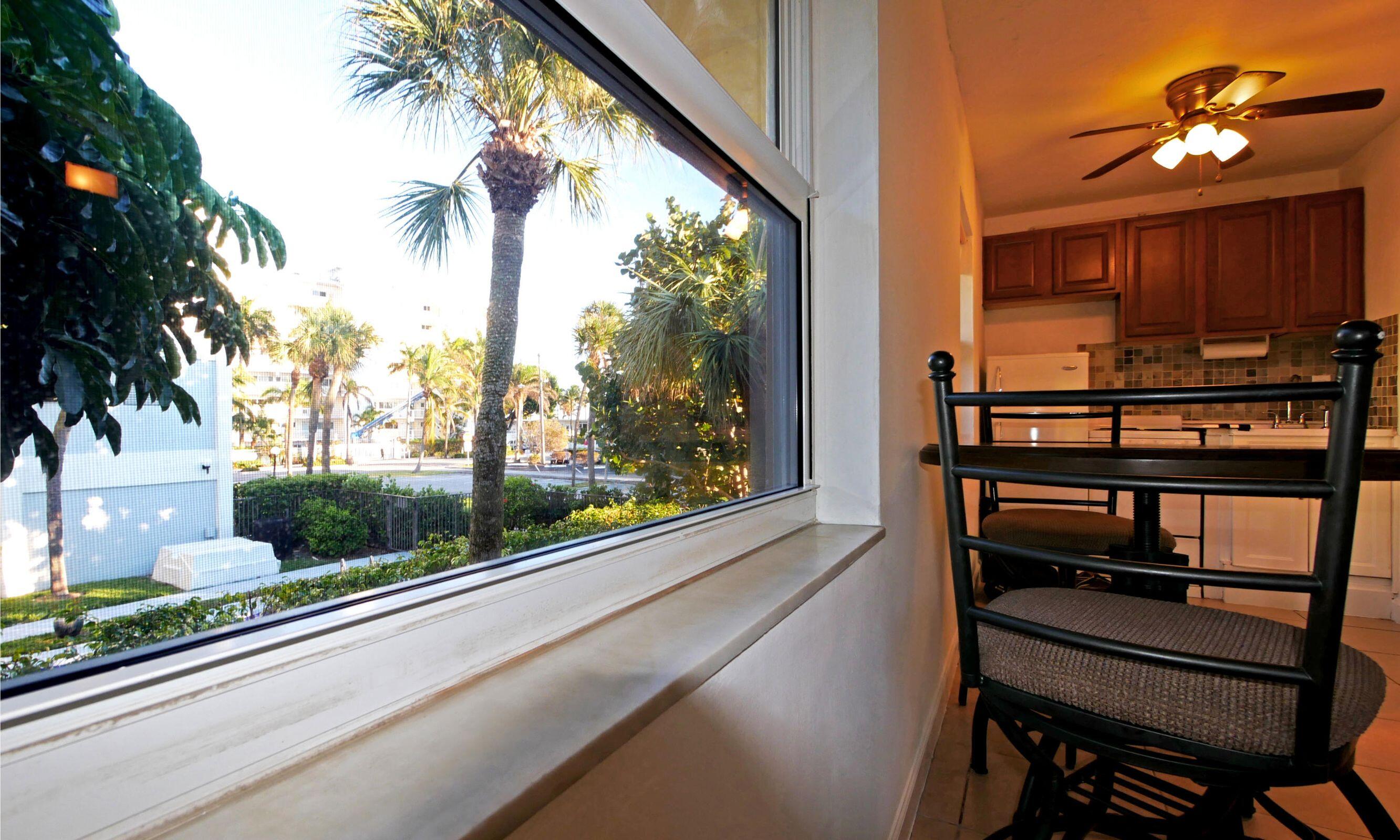 2031 Southeast 5th Street, Unit 8 Deerfield Beach, FL 33441 - Photo 8 of 13 a view of a balcony with furniture and a window