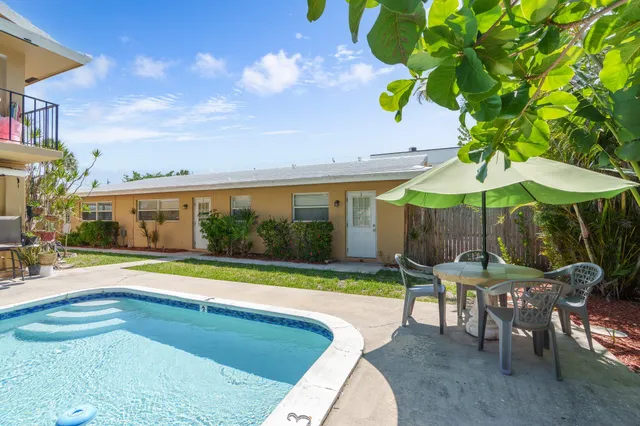 an aerial view of a house with outdoor space