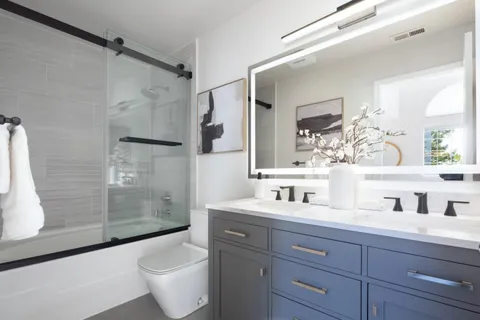 a bathroom with a sink toilet and shower