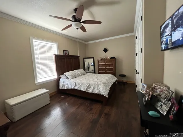 a bedroom with a bed and a couch