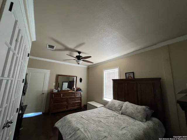 a bedroom with a bed and furniture