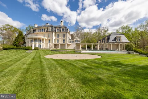 a view of a kitchen with a sink and a washer dryer
