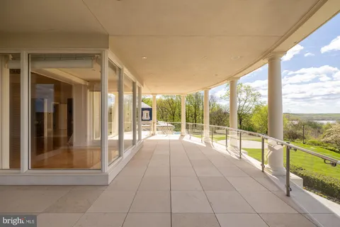 a view of an empty room with a chandelier