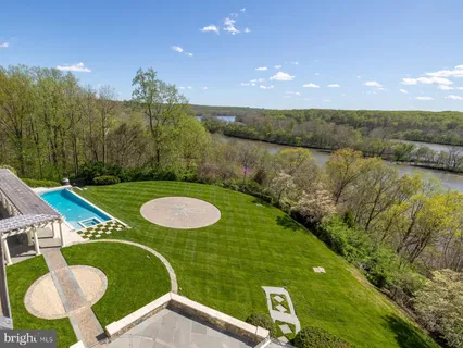a kitchen with stainless steel appliances granite countertop a sink and a refrigerator