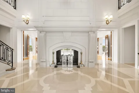 a view of an empty room with a fireplace and a window