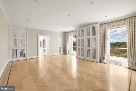 a lobby with furniture and floor to ceiling window