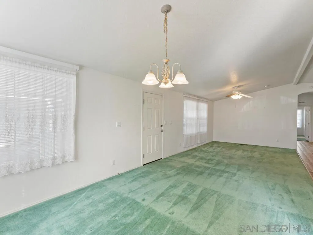 9500 Harritt Road, Unit 31 Lakeside, CA 92040 - Photo 12 of 33 a view of a big room with windows and chandelier fan