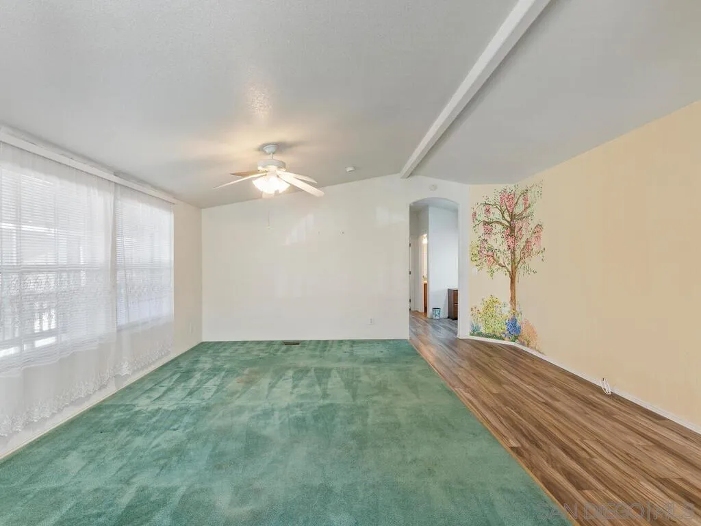 9500 Harritt Road, Unit 31 Lakeside, CA 92040 - Photo 14 of 33 a view of a big room with windows and chandelier fan