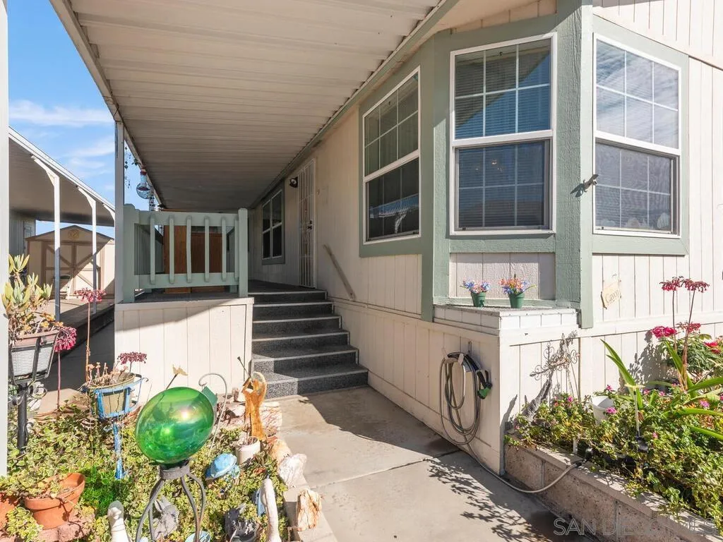 9500 Harritt Road, Unit 31 Lakeside, CA 92040 - Photo 2 of 33 a front view of a house with a yard
