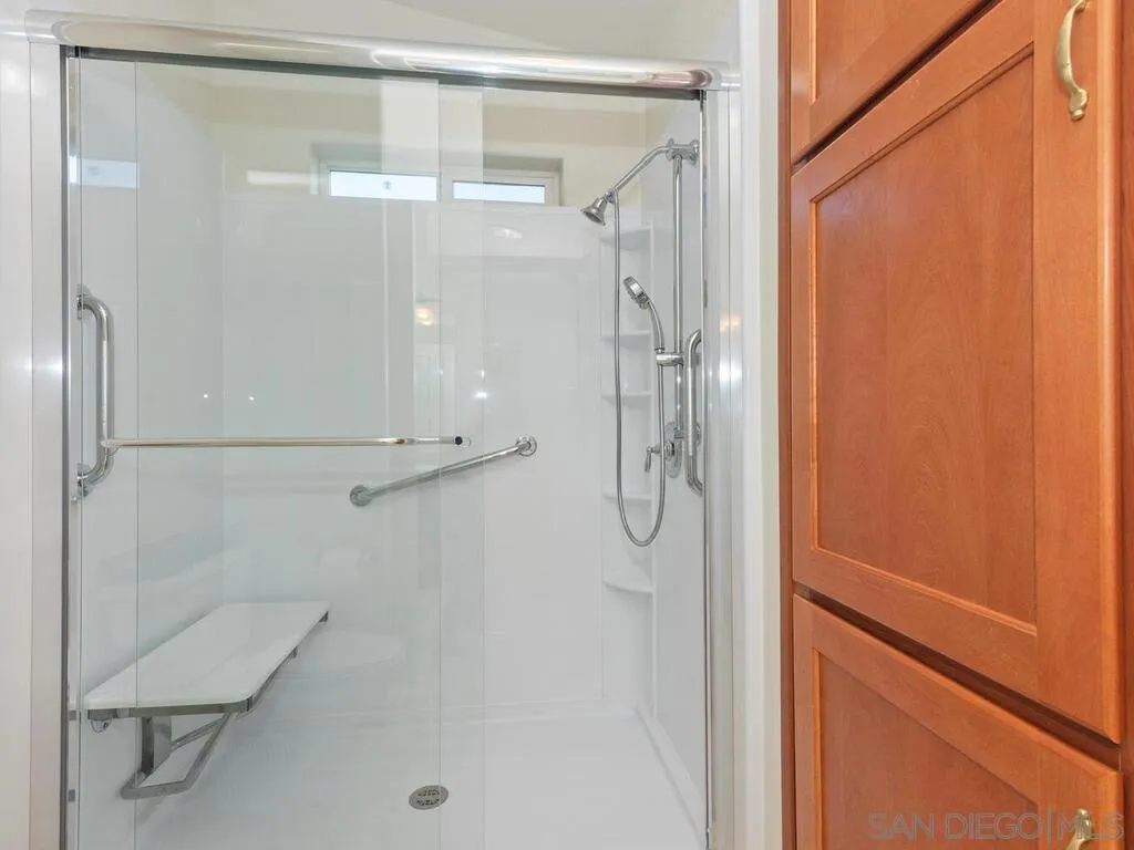 9500 Harritt Road, Unit 31 Lakeside, CA 92040 - Photo 21 of 33 a bathroom with a glass shower door