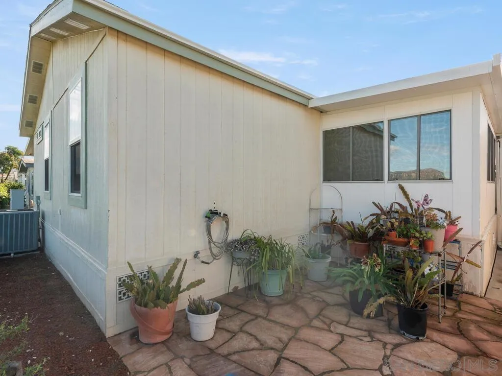 9500 Harritt Road, Unit 31 Lakeside, CA 92040 - Photo 29 of 33 a potted plant sitting in front of a house