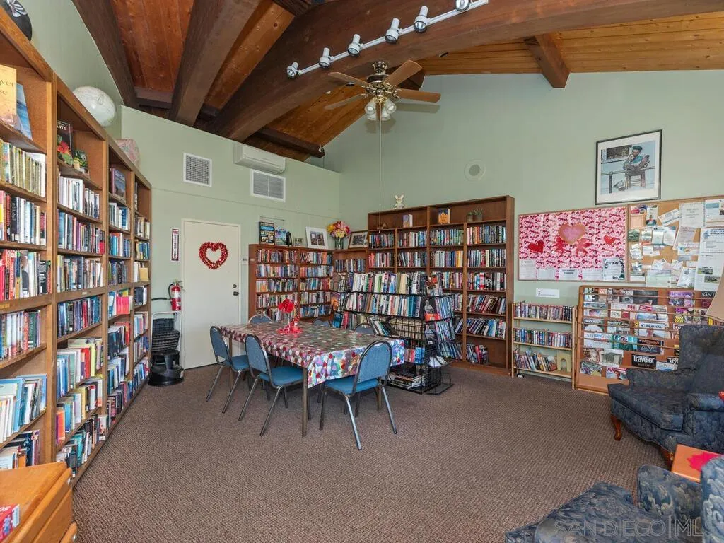 9500 Harritt Road, Unit 31 Lakeside, CA 92040 - Photo 33 of 33 a living room with lots of furniture and a book shelf