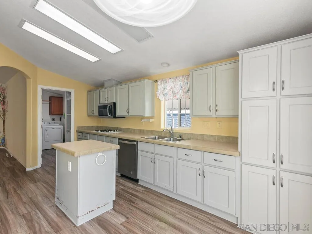 9500 Harritt Road, Unit 31 Lakeside, CA 92040 - Photo 9 of 33 a kitchen with granite countertop white cabinets and white appliances