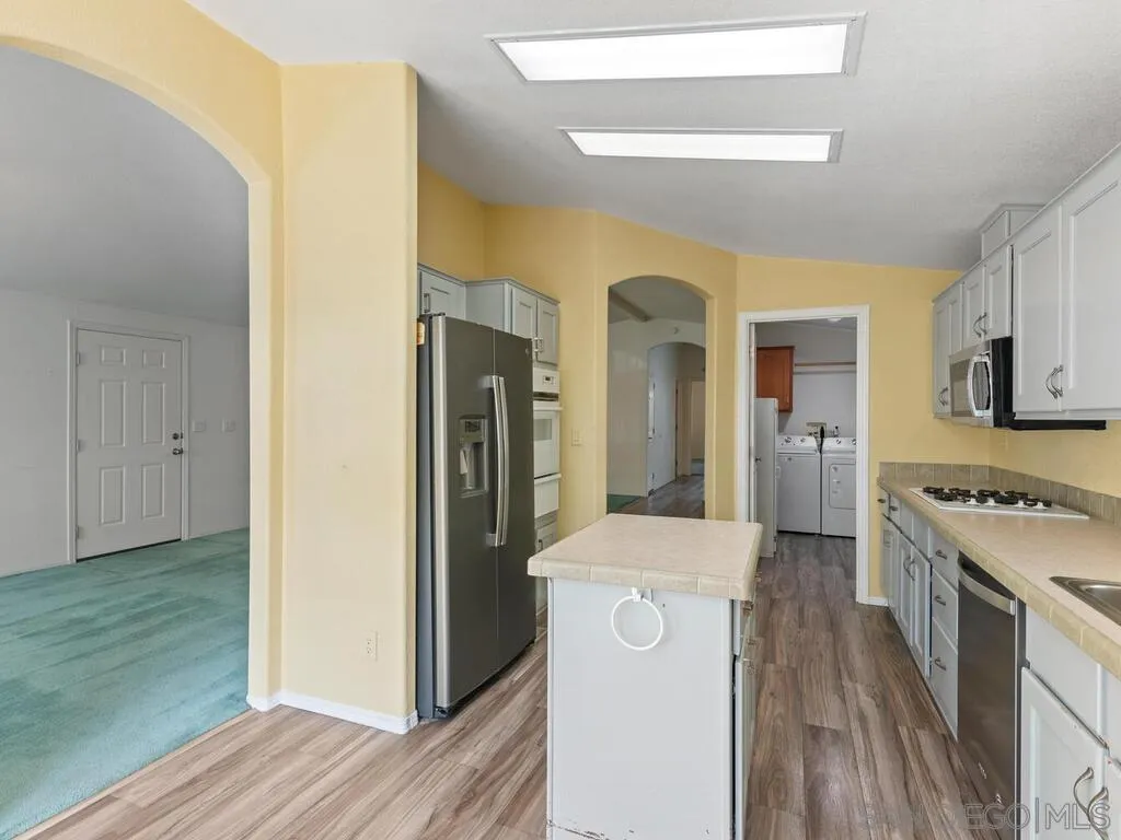 9500 Harritt Road, Unit 31 Lakeside, CA 92040 - Photo 10 of 33 a view of a kitchen cabinets and a wooden floor