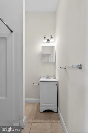 a utility room with sink dryer and washer