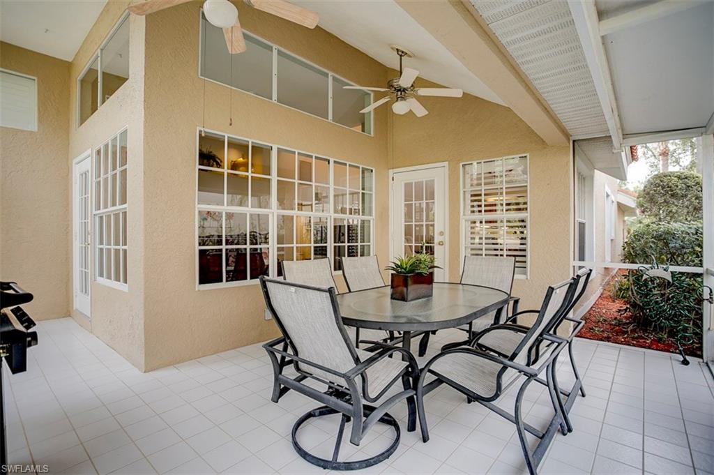 168 Napa Ridge Way Naples, FL 34119 - Photo 20 of 22 a view of a dining room with furniture and front door