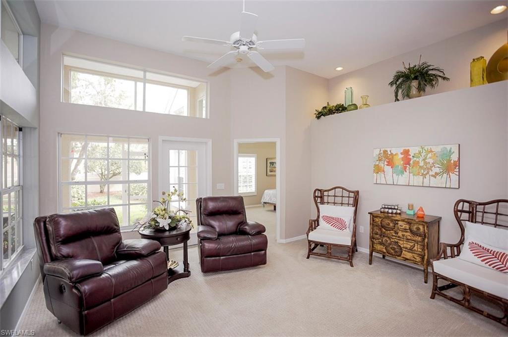 168 Napa Ridge Way Naples, FL 34119 - Photo 7 of 22 a living room with furniture and a large window