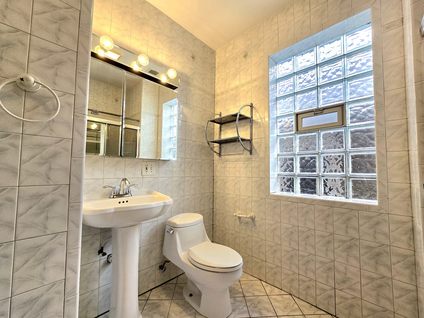 2126 West 24th Street, Unit 2 Chicago, IL 60608 - Photo 11 of 16 a bathroom with a sink a toilet and shower